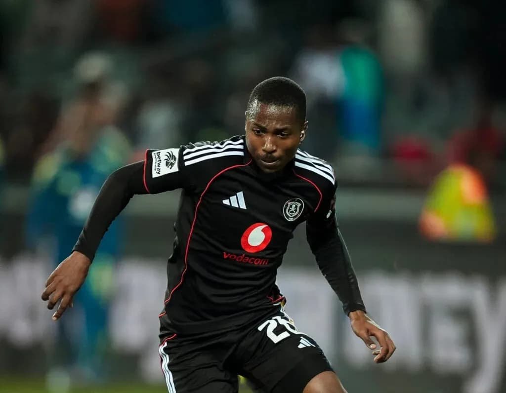 Player in black jersey running on the field Player in black jersey running on the field