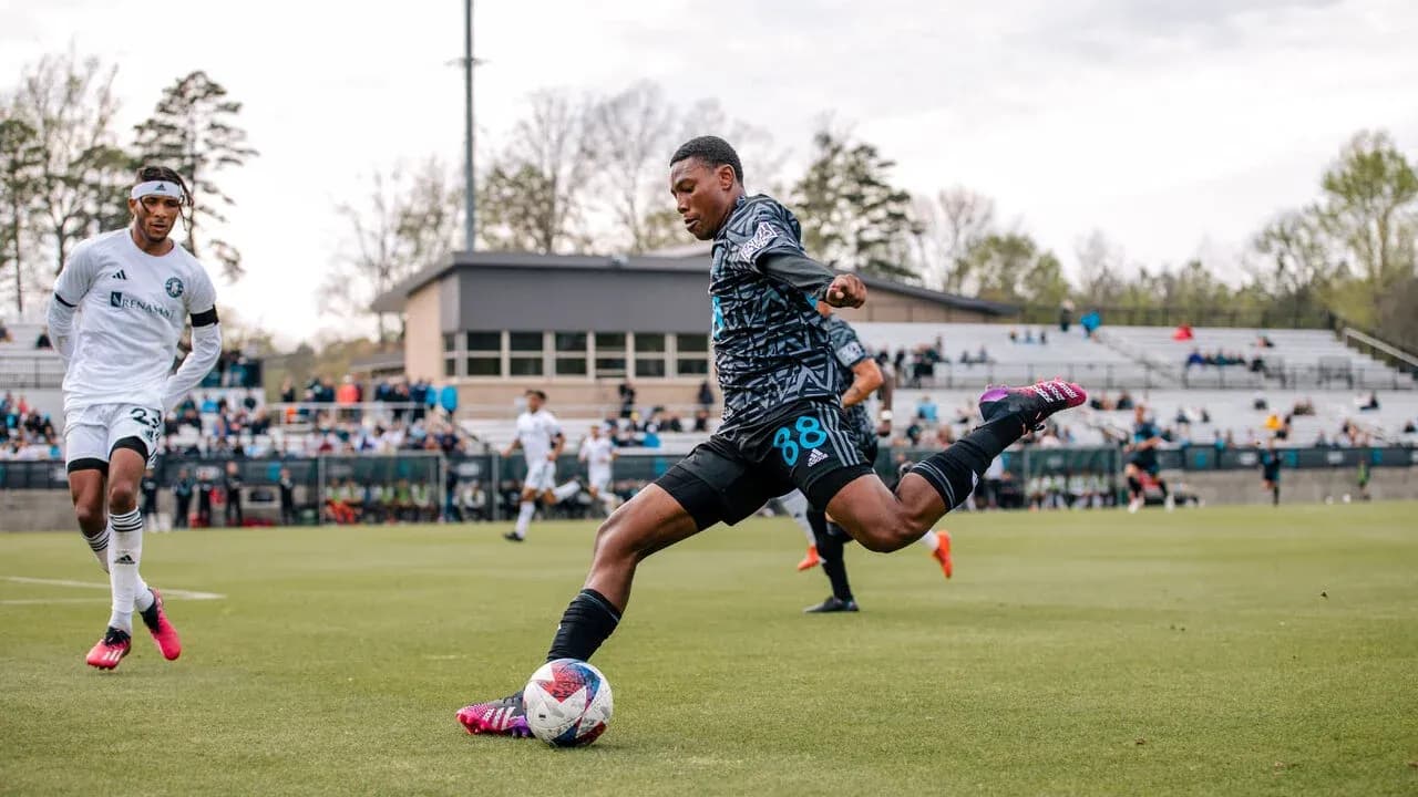 Player kicking the ball during Huntsville City match Player kicking the ball during Huntsville City match