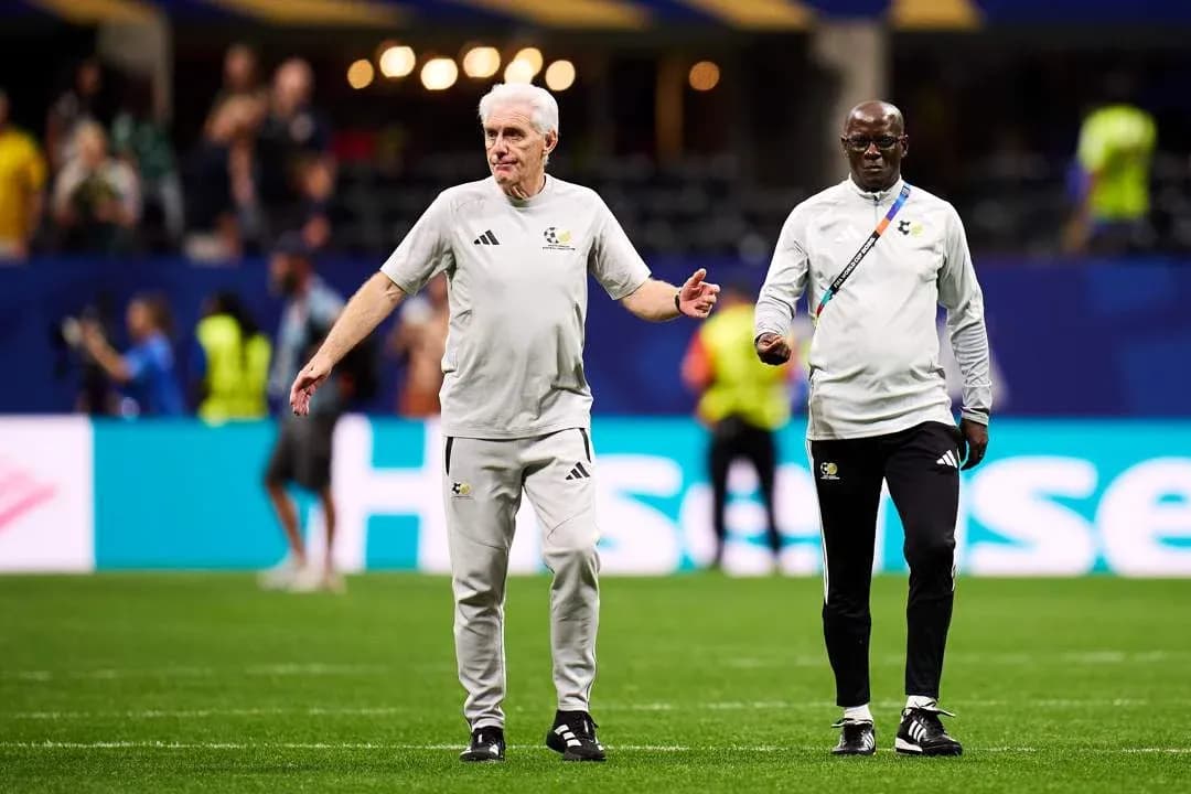 Coaches walking on the field before a match Coaches walking on the field before a match