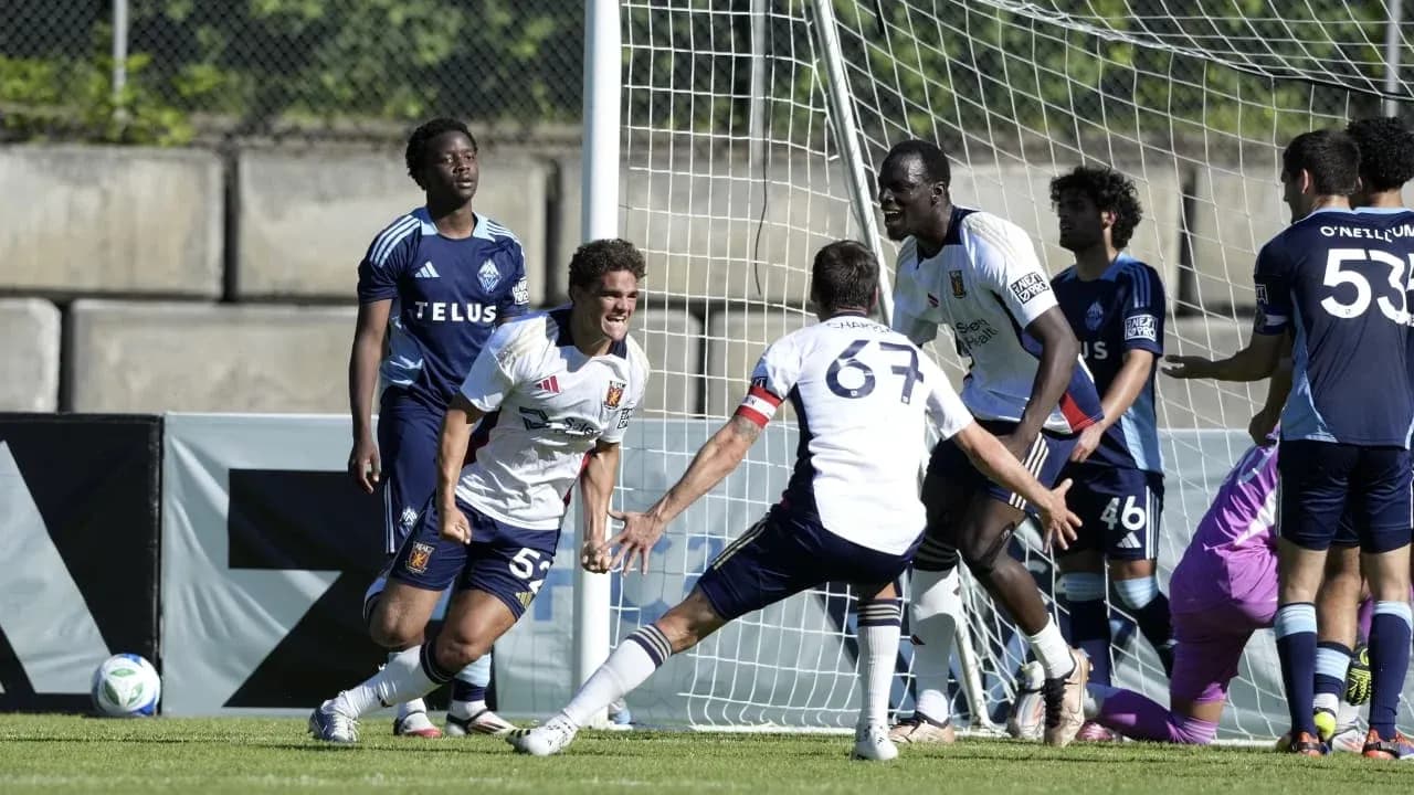 Players celebrating a goal during match Players celebrating a goal during match