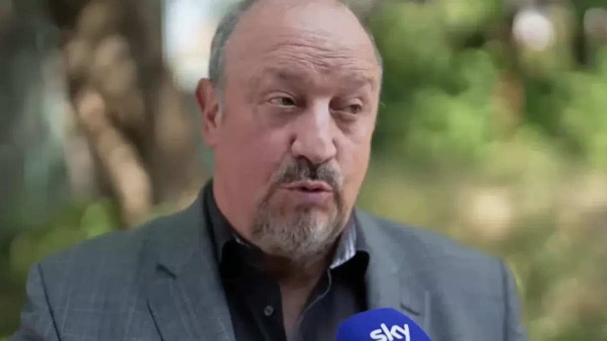 Man speaking into a microphone outdoors Man speaking into a microphone outdoors
