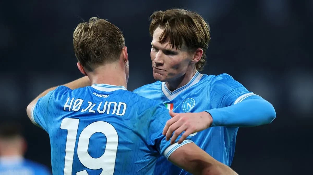 Two Napoli players celebrating a goal together Two Napoli players celebrating a goal together