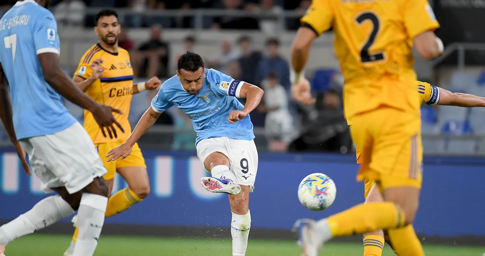 Lazio player shooting at goal during match Lazio player shooting at goal during match