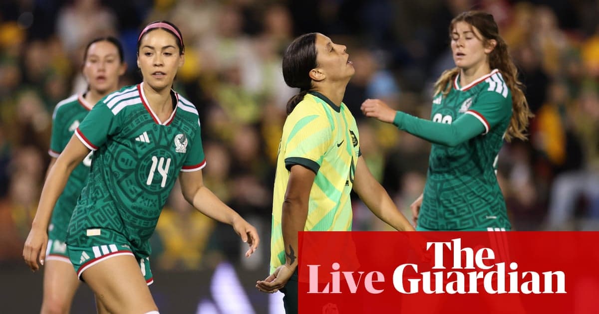 Players from Mexico and Australia during a soccer match Players from Mexico and Australia during a soccer match