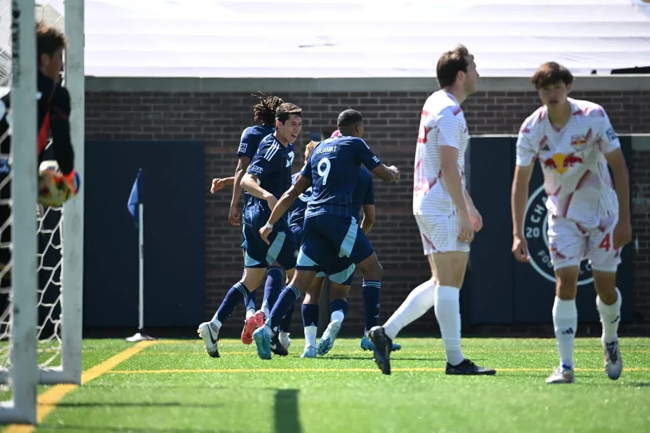 Players celebrating a goal during match Players celebrating a goal during match