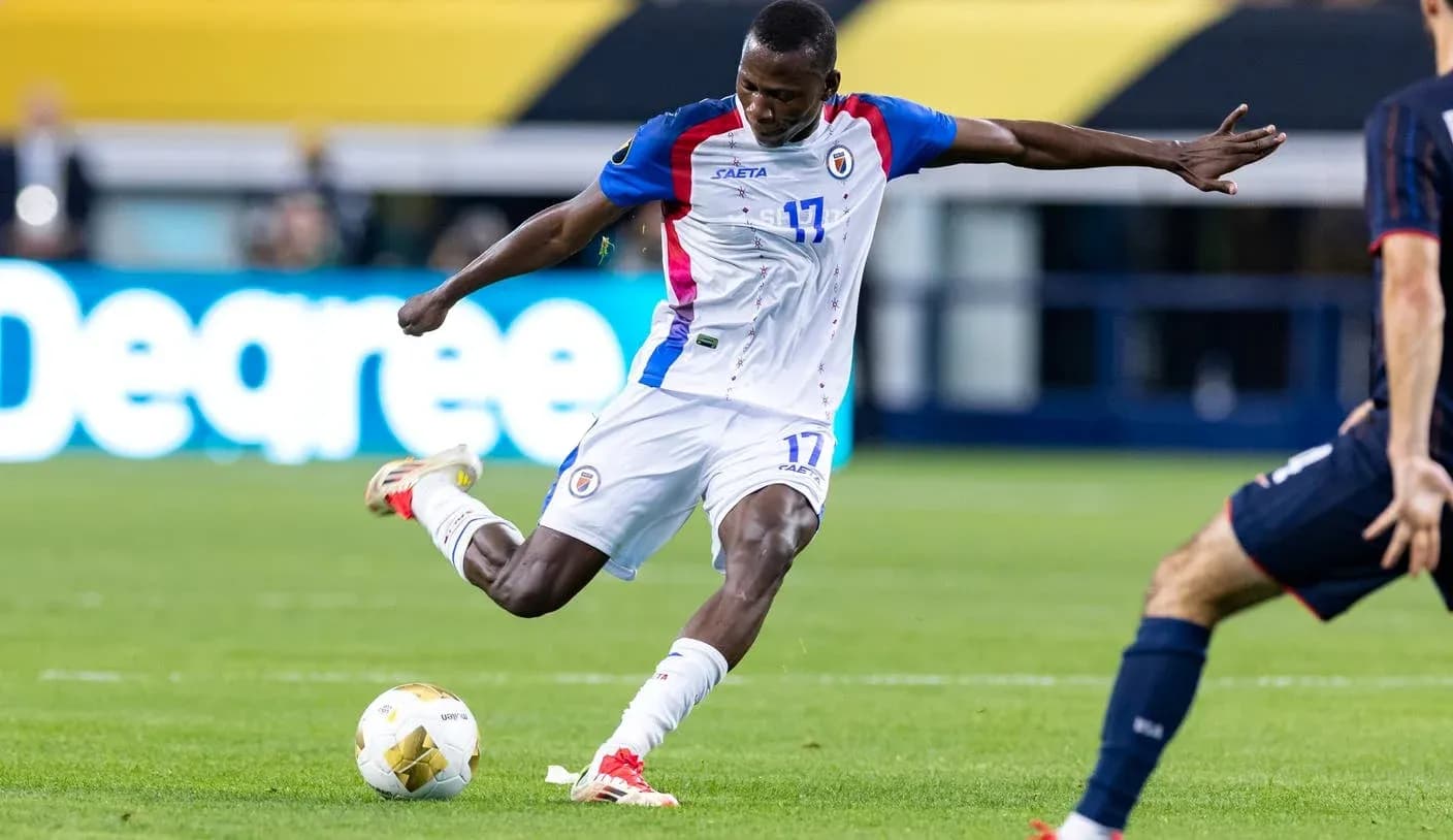 Haitian player taking a shot during match Haitian player taking a shot during match