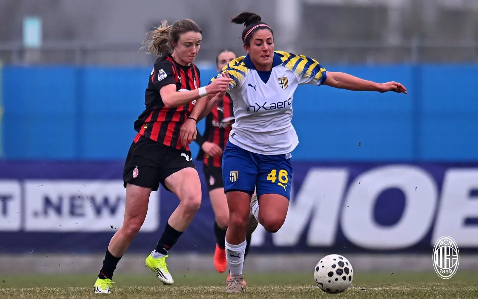 AC Milan and Parma players competing for the ball AC Milan and Parma players competing for the ball