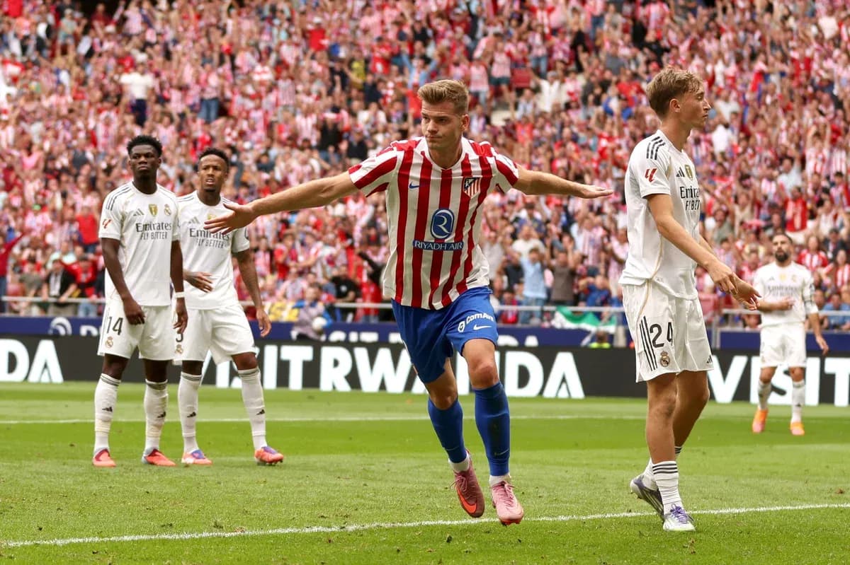 Atletico Madrid player celebrating goal against Real Madrid Atletico Madrid player celebrating goal against Real Madrid