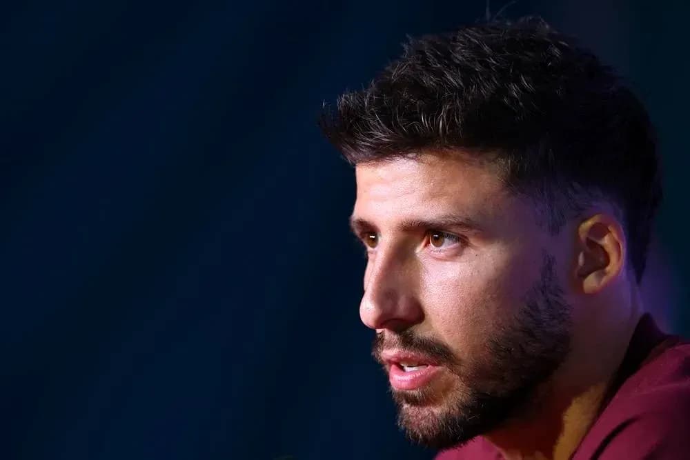 Player speaking at a press conference Player speaking at a press conference