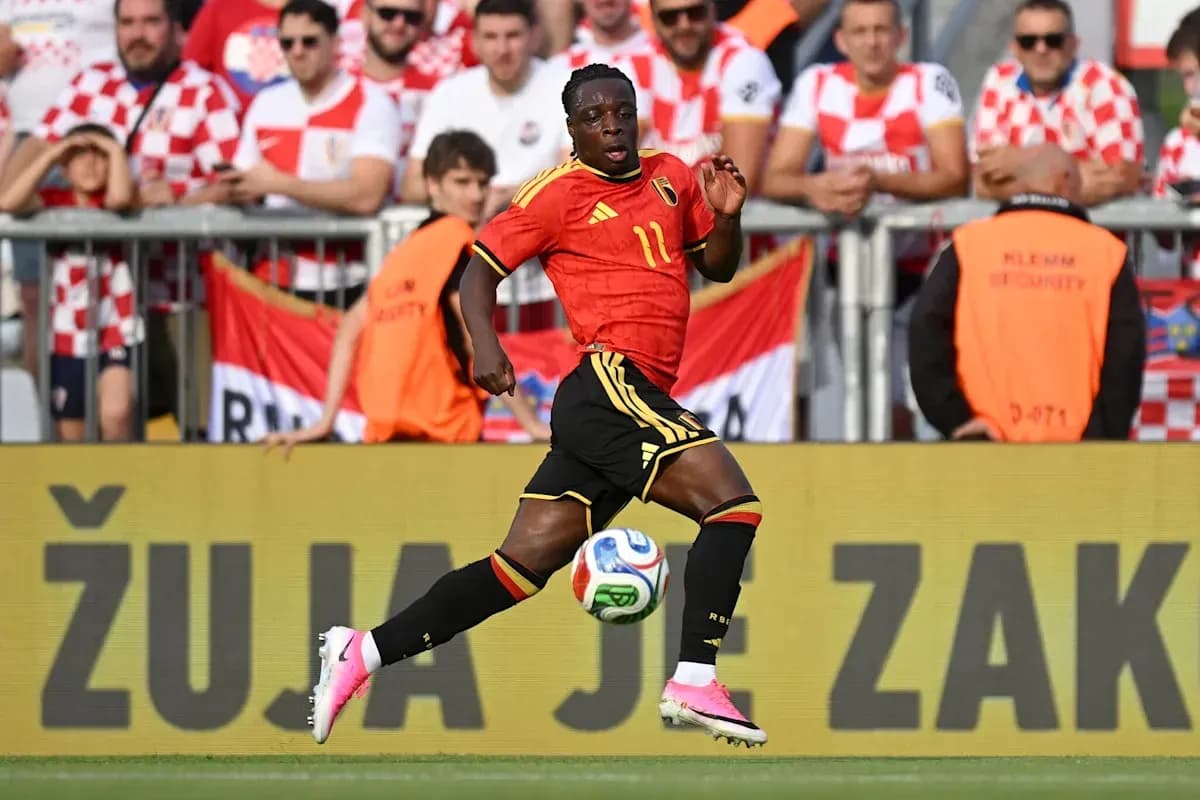 Belgian player sprinting with ball during match Belgian player sprinting with ball during match