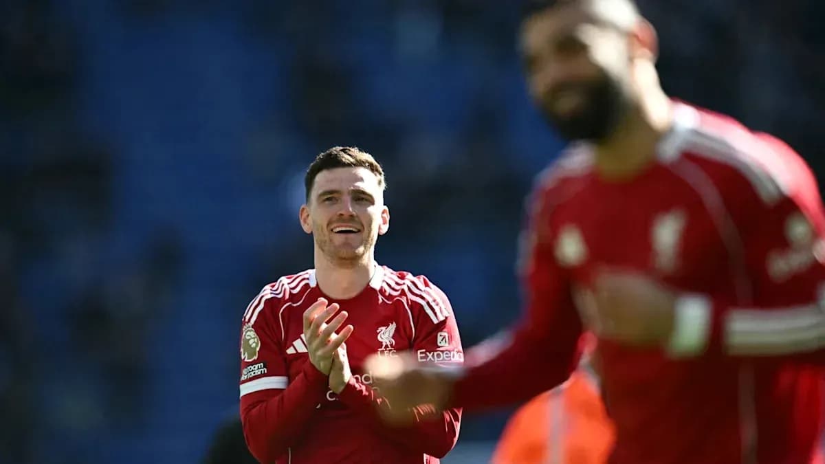 Liverpool players celebrating on the pitch after match Liverpool players celebrating on the pitch after match