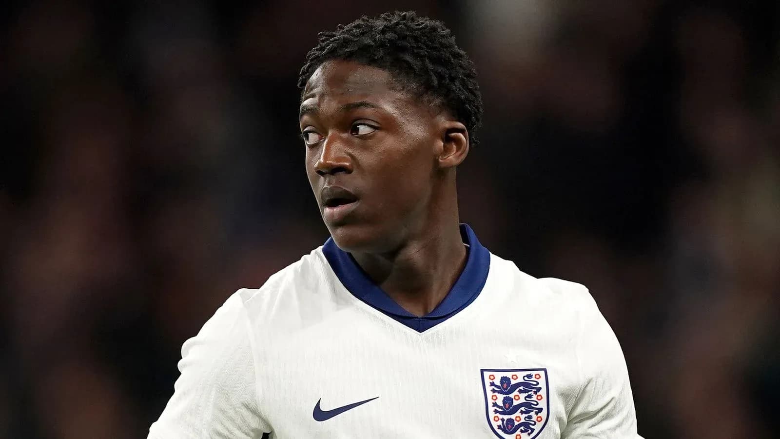 Football player wearing England kit during match Football player wearing England kit during match