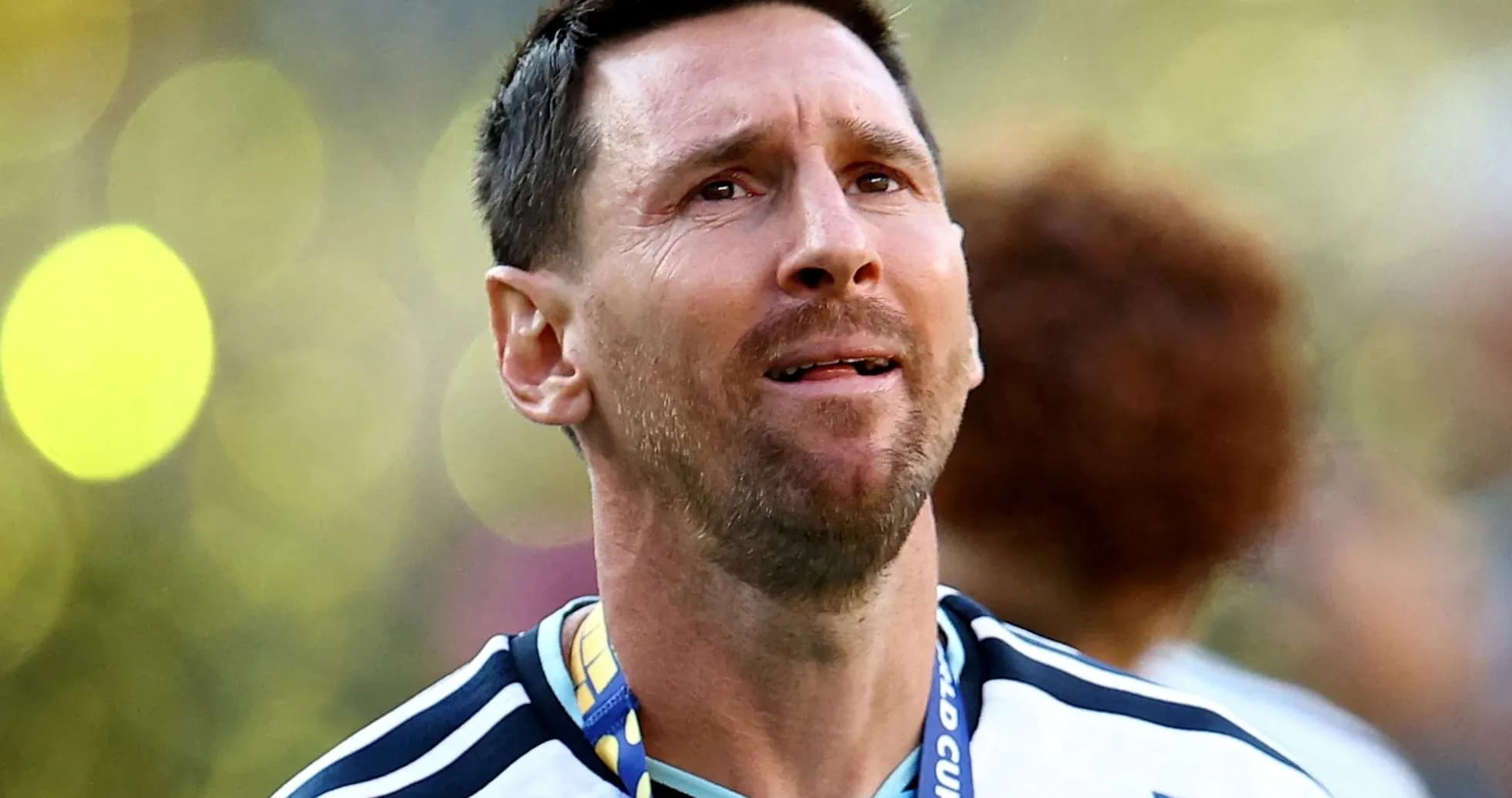 Player wearing Argentina jersey celebrating with medal Player wearing Argentina jersey celebrating with medal