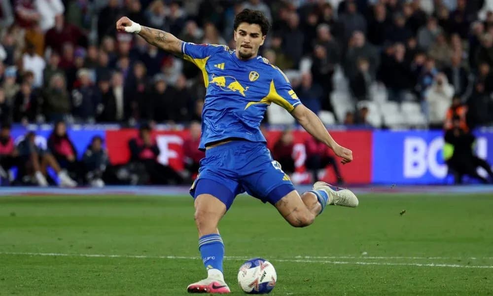 Player kicking the ball during a match Player kicking the ball during a match