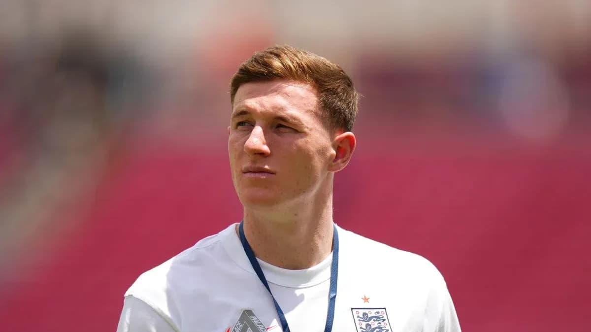 Player wearing England jersey on the field Player wearing England jersey on the field