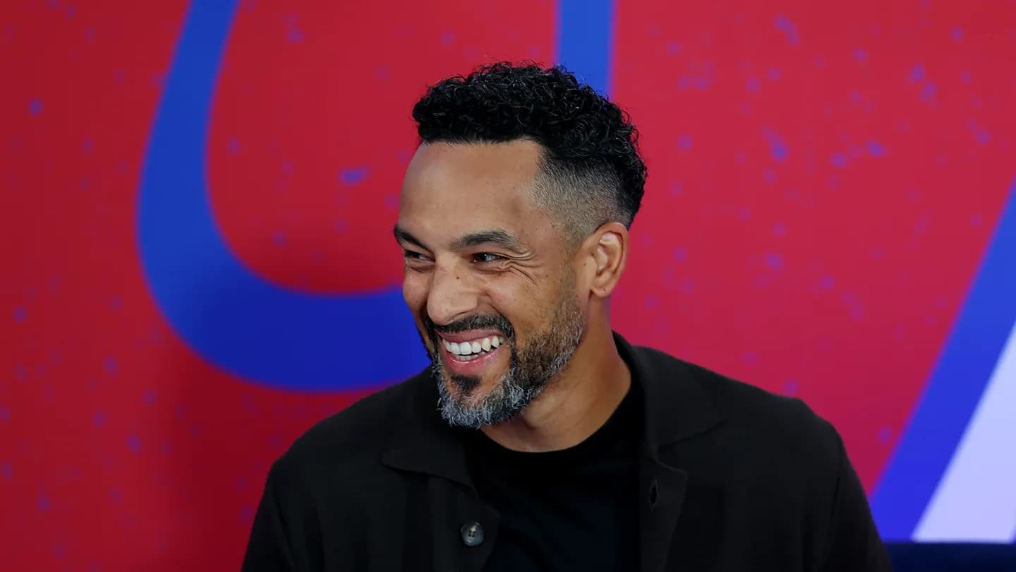 Man smiling in front of a colorful background Man smiling in front of a colorful background