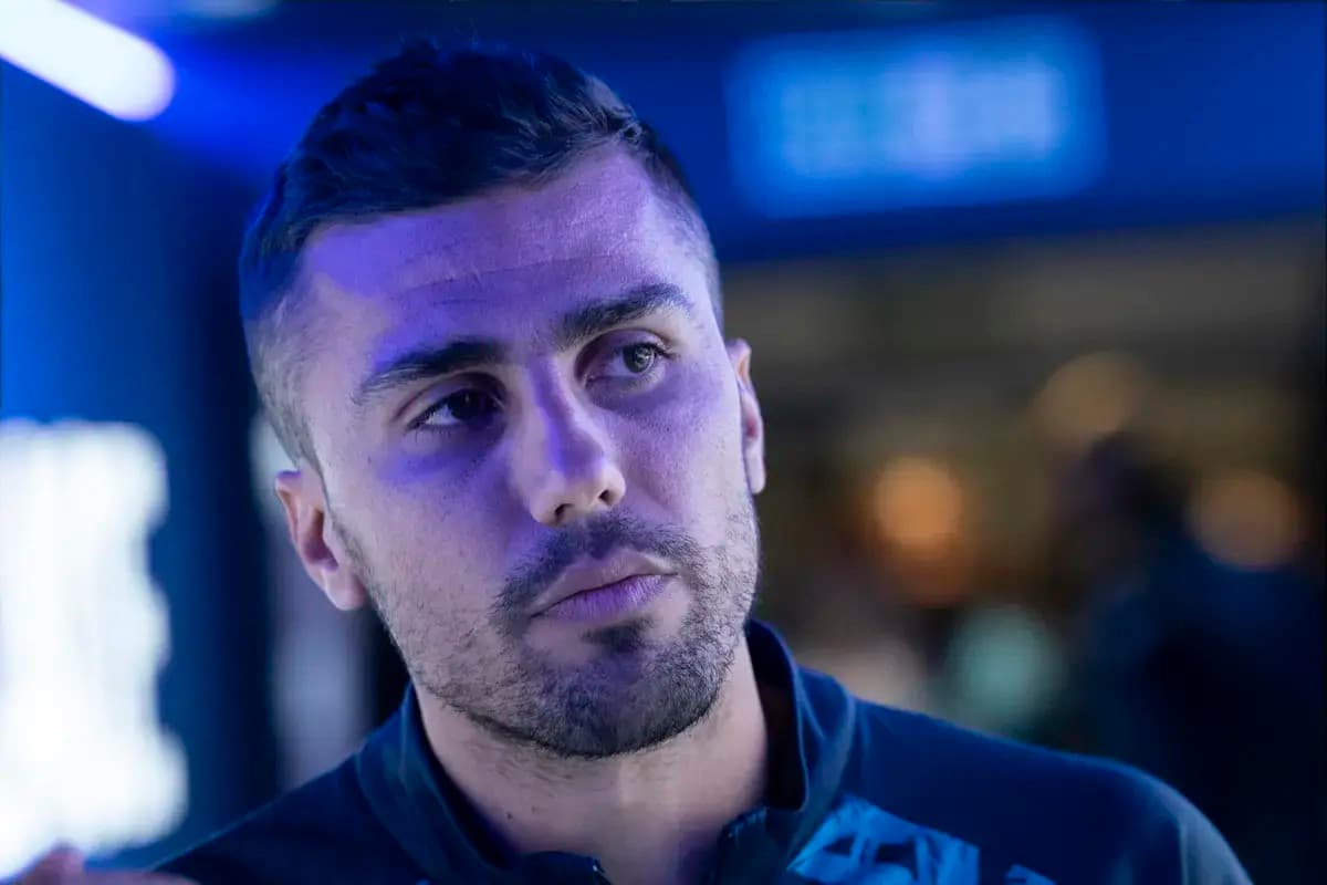 Athlete in a blue-lit environment during event Athlete in a blue-lit environment during event