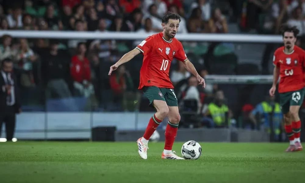 Player in red jersey controlling the ball during match Player in red jersey controlling the ball during match