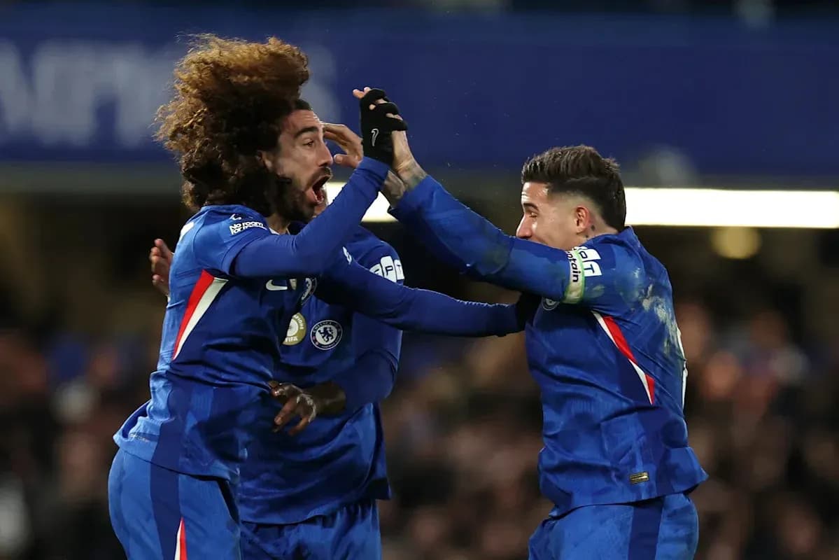 Chelsea players celebrating a goal on the pitch Chelsea players celebrating a goal on the pitch