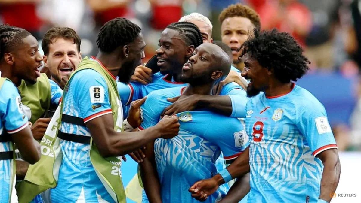 Players celebrating a goal on the field Players celebrating a goal on the field