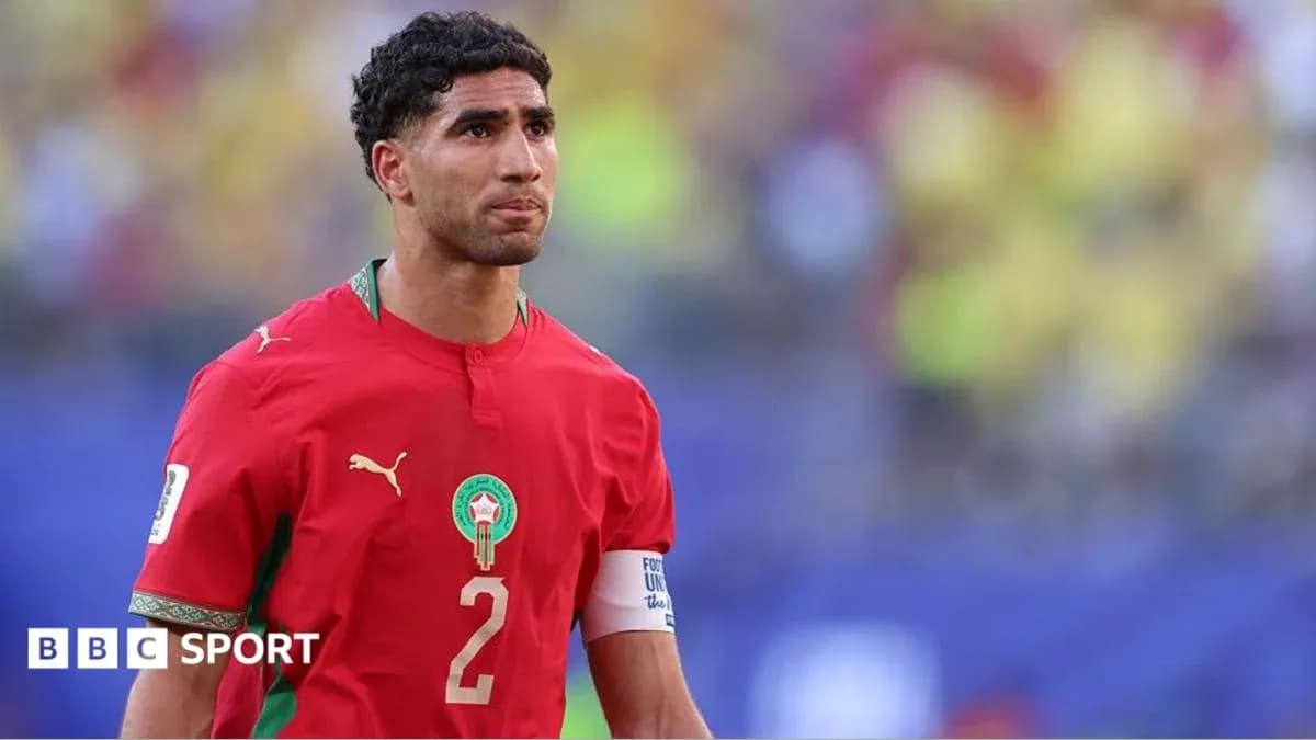 Morocco player wearing red jersey on field Morocco player wearing red jersey on field