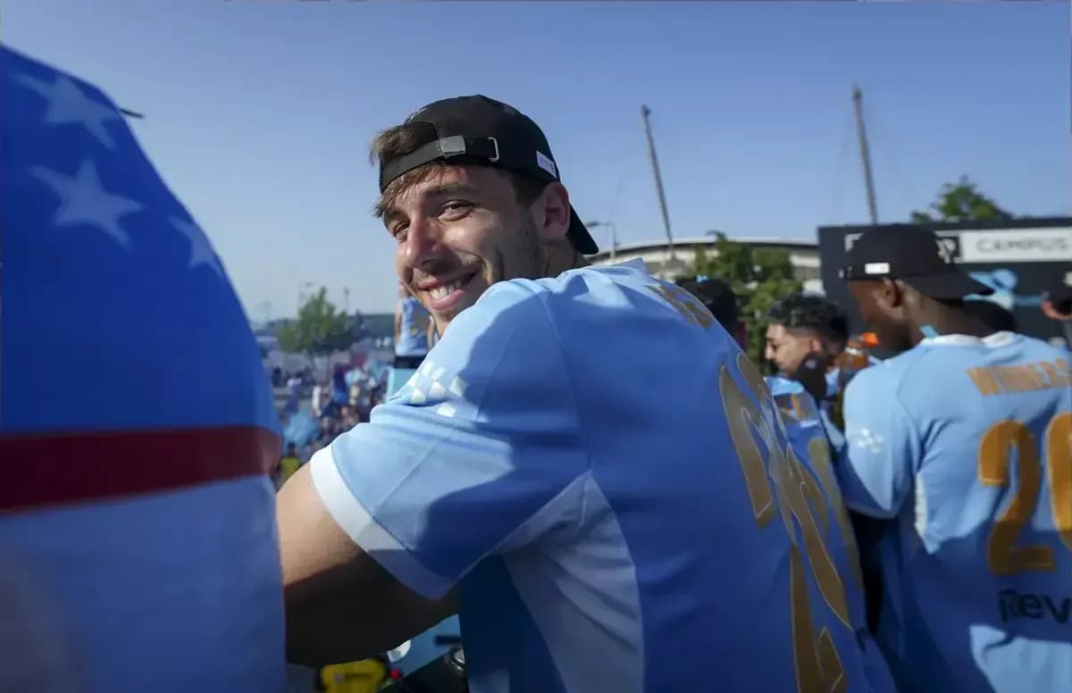Player smiling while celebrating with teammates Player smiling while celebrating with teammates