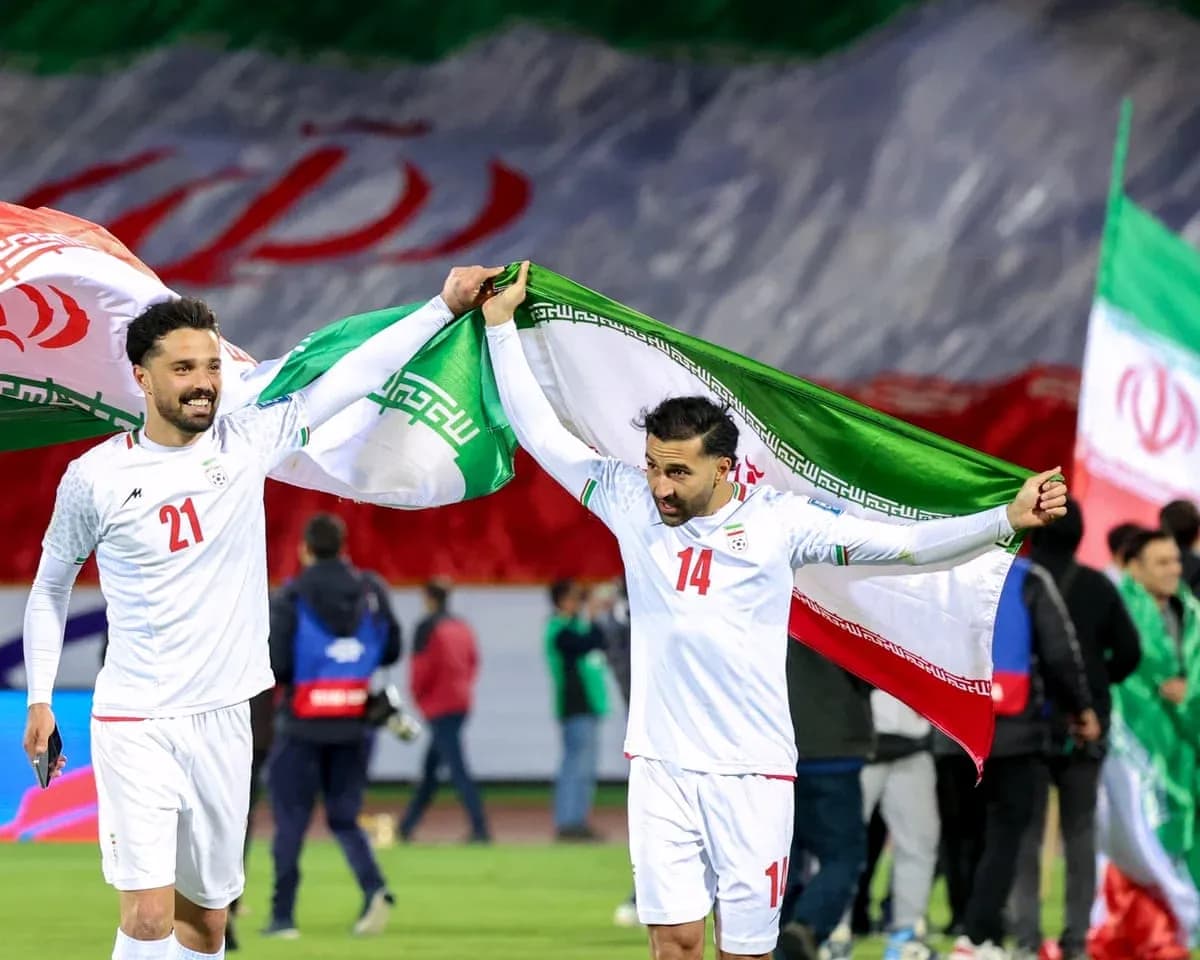 Iranian players celebrating with national flags Iranian players celebrating with national flags