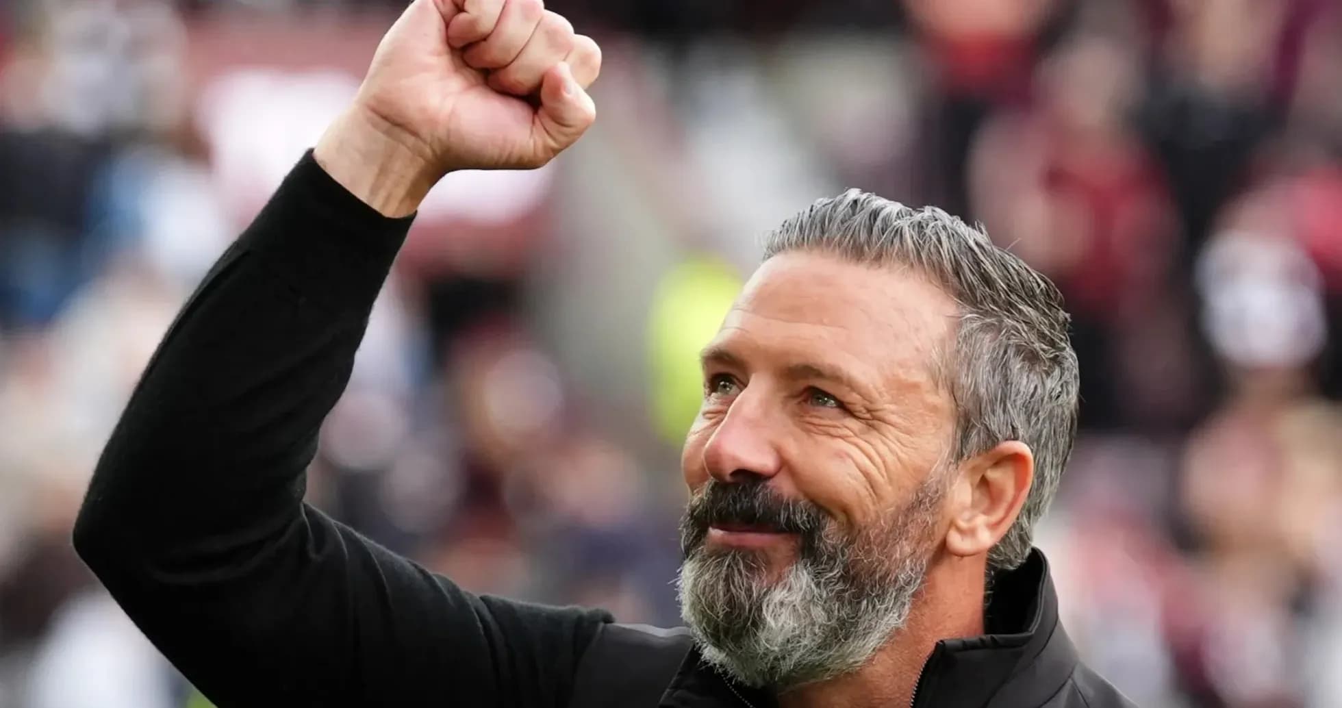Coach celebrating with raised fist during match Coach celebrating with raised fist during match