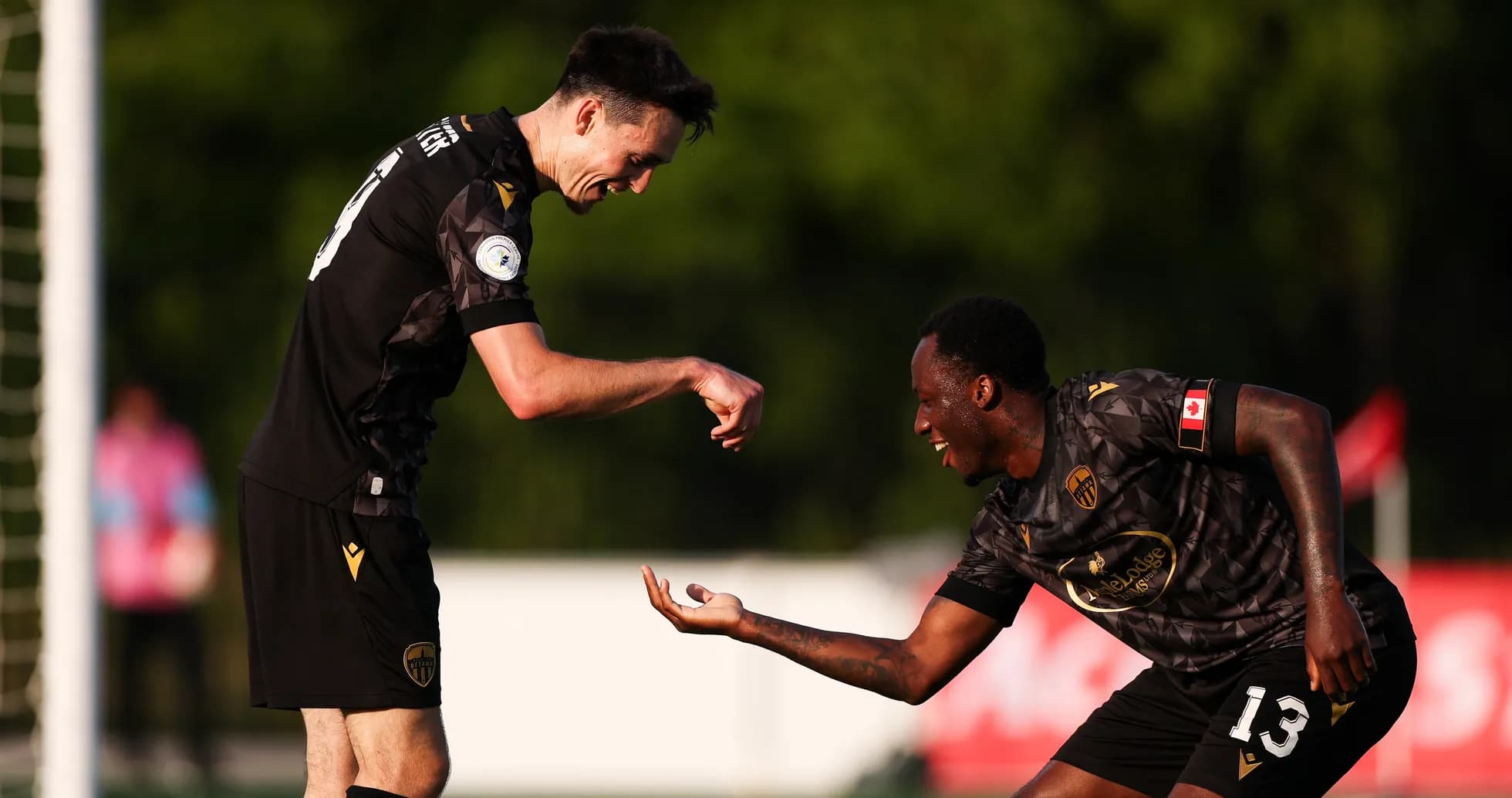 Players celebrating a goal during match Players celebrating a goal during match