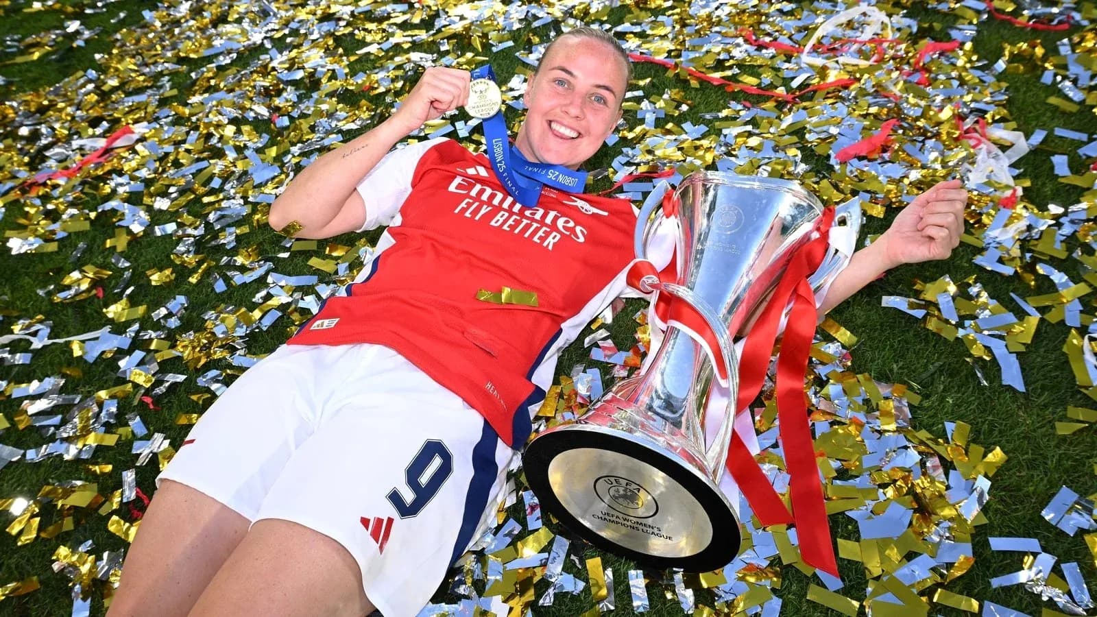 Player celebrating with trophy and medal on confetti Player celebrating with trophy and medal on confetti