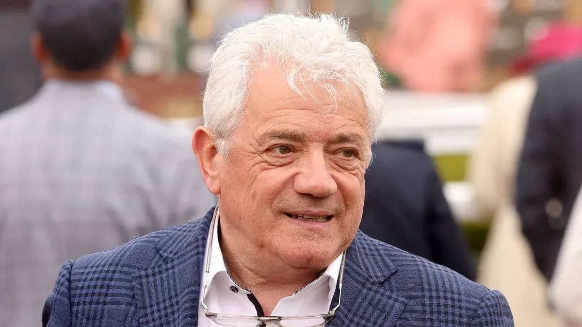 Man in a checkered suit at an event Man in a checkered suit at an event