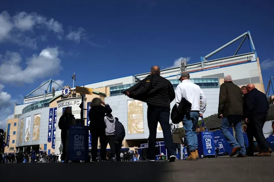 Fans walking towards Chelsea FC stadium entrance Fans walking towards Chelsea FC stadium entrance