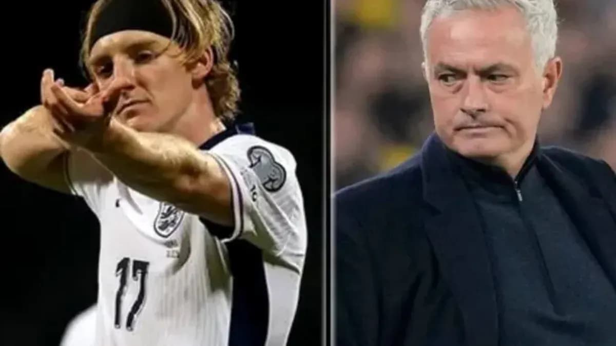 Player celebrating goal and manager observing match Player celebrating goal and manager observing match