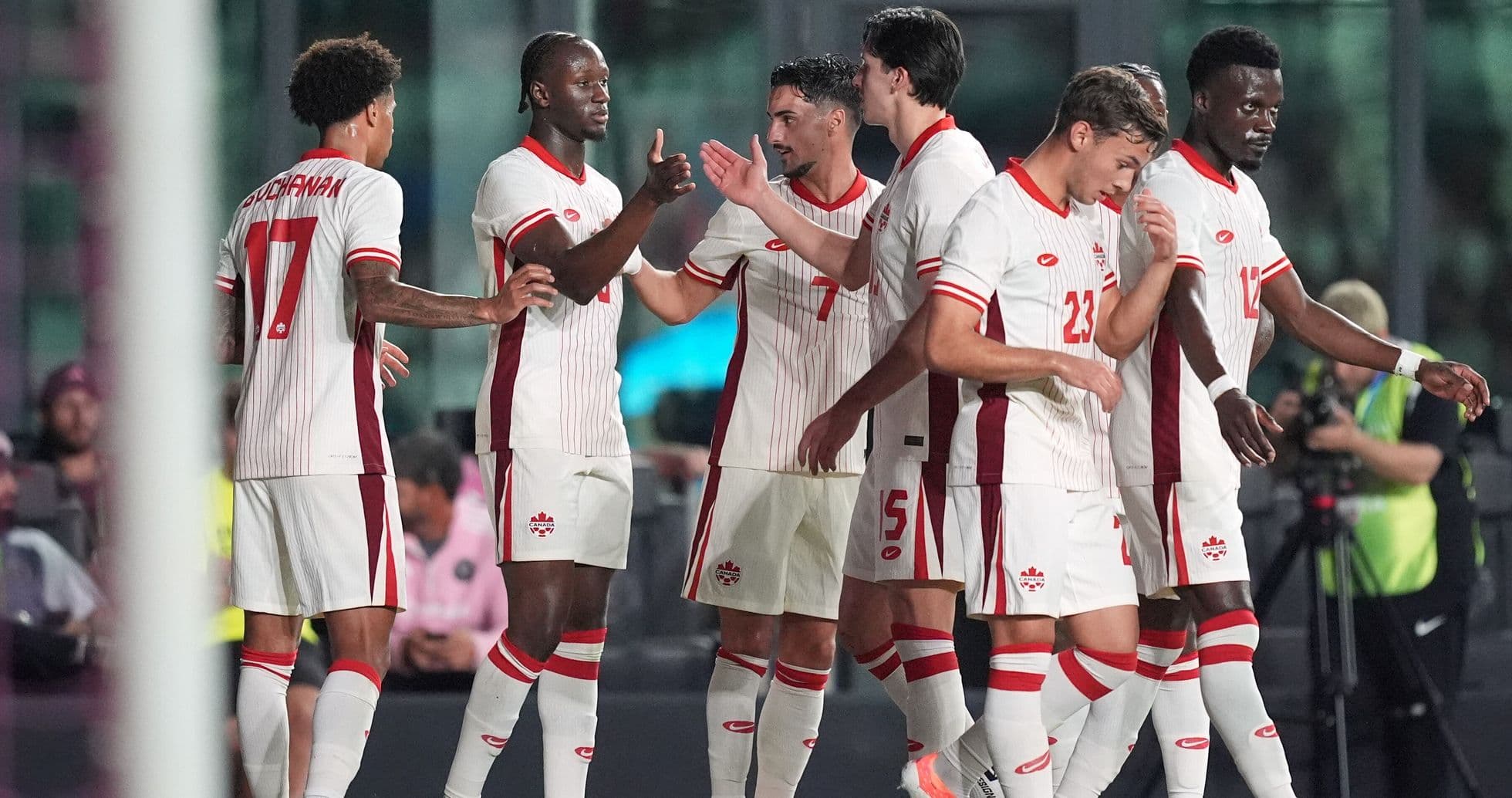 Canada players celebrating after scoring a goal Canada players celebrating after scoring a goal