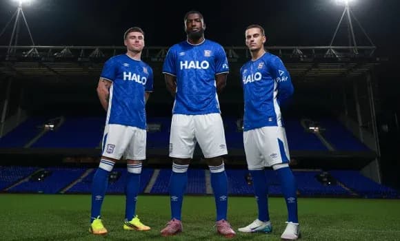 Three players posing in blue Ipswich Town kits Three players posing in blue Ipswich Town kits