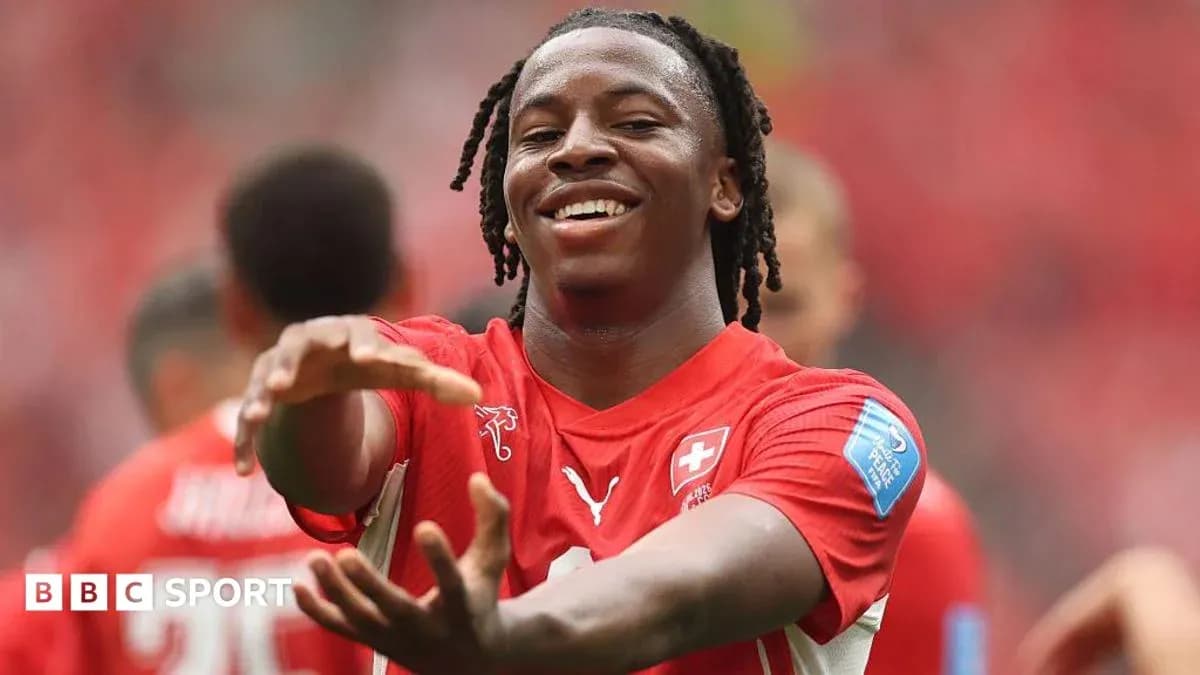 Player celebrating in red jersey during match Player celebrating in red jersey during match