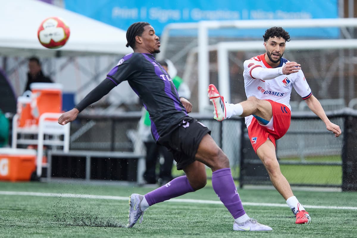 Player kicking ball during Vancouver FC match Player kicking ball during Vancouver FC match