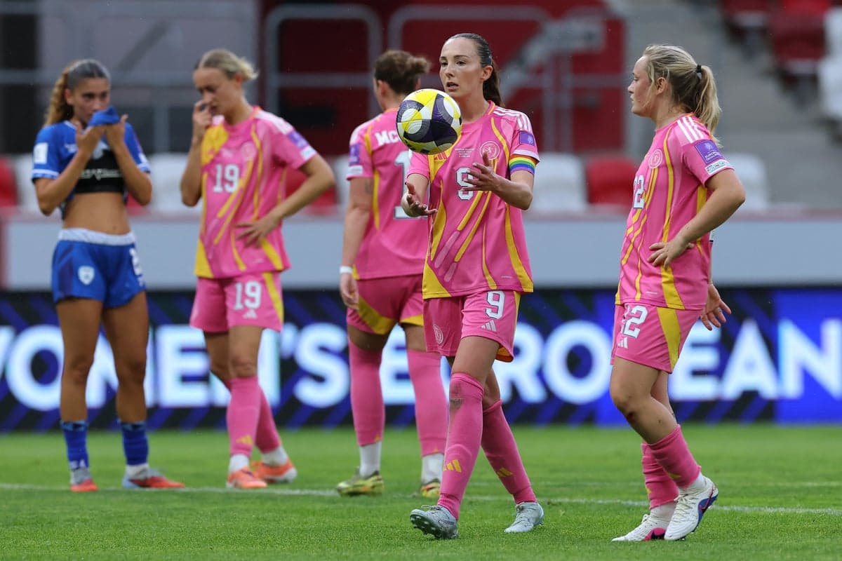 Players in pink jerseys during a match Players in pink jerseys during a match