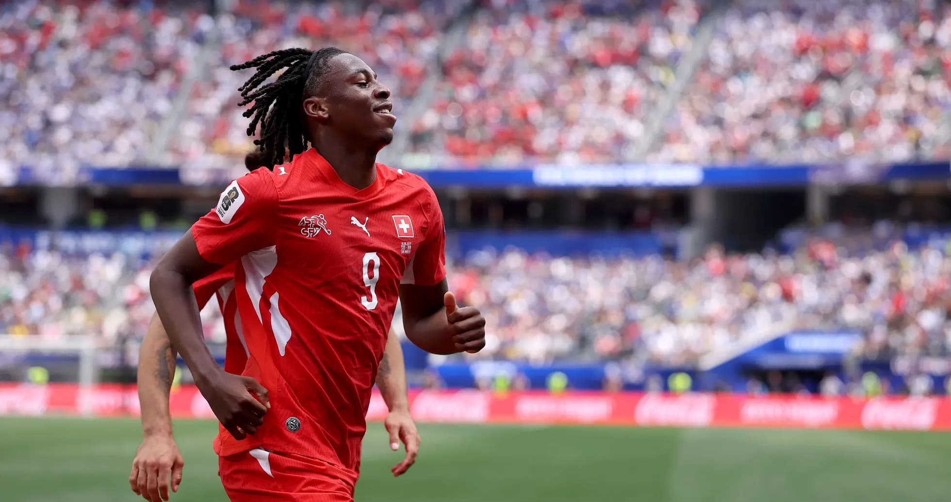 Player celebrating during a soccer match Player celebrating during a soccer match