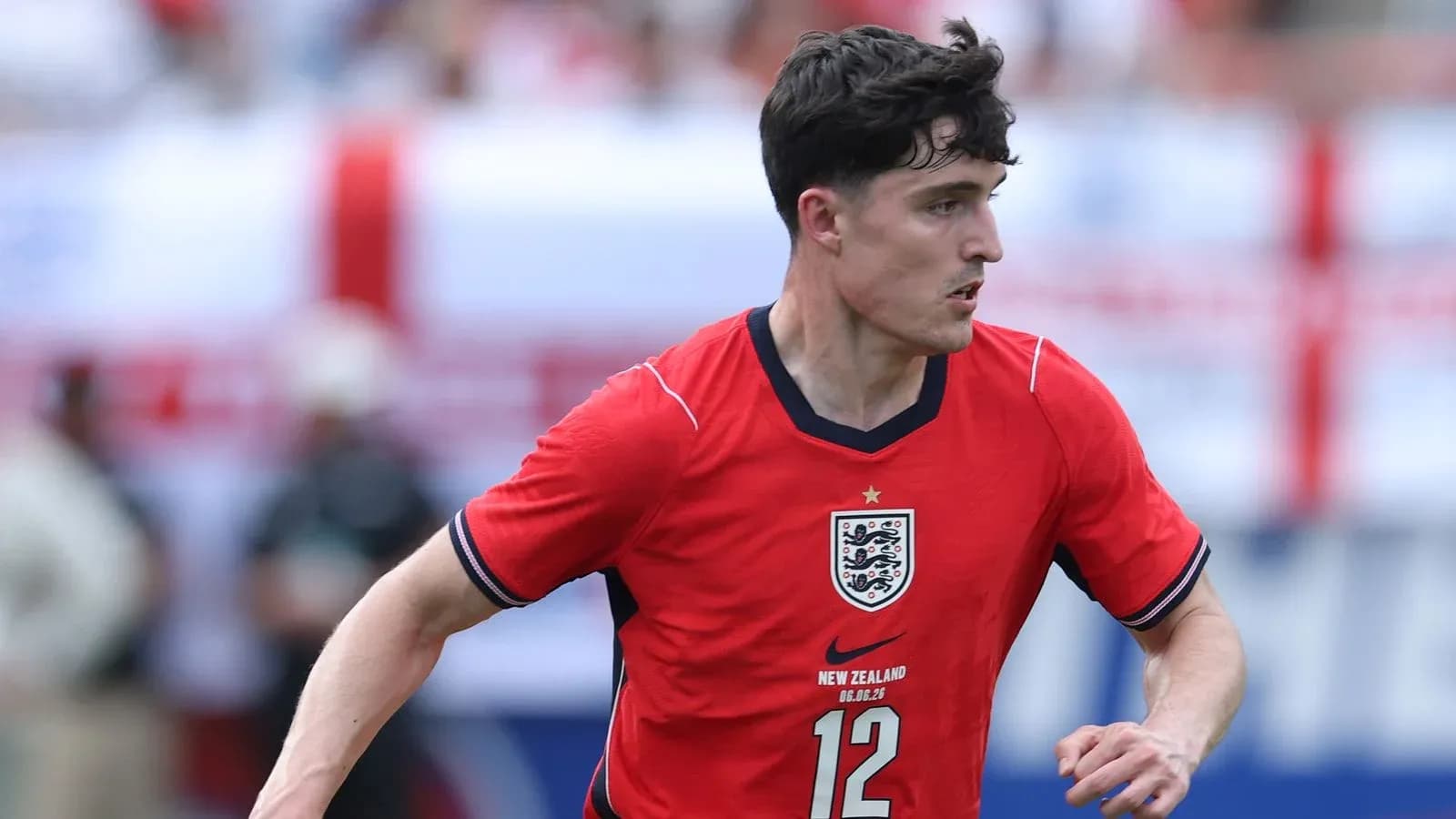 Player running with ball in red England jersey Player running with ball in red England jersey