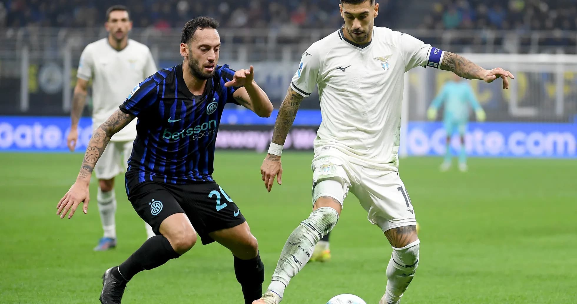 Lazio player challenging Inter player for the ball Lazio player challenging Inter player for the ball