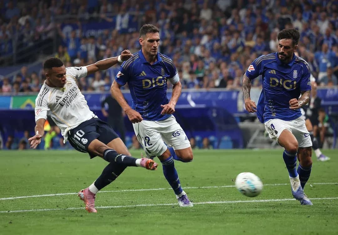 Real Madrid player taking a shot against Oviedo Real Madrid player taking a shot against Oviedo