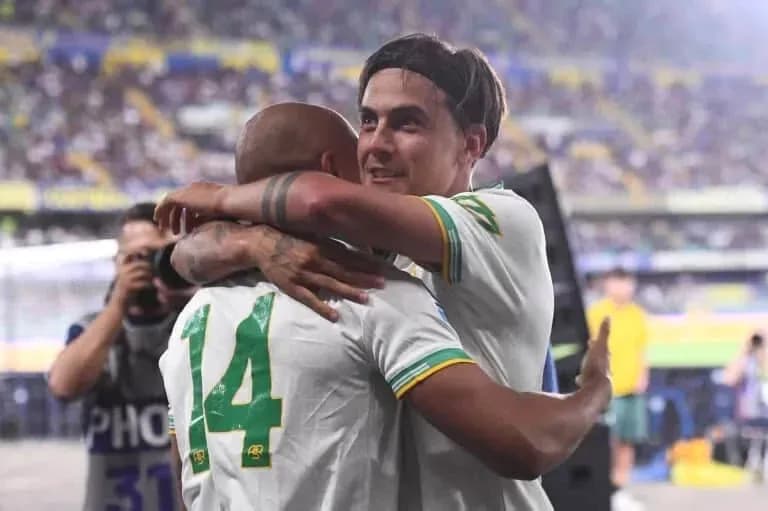 Two players celebrating with an embrace after match Two players celebrating with an embrace after match