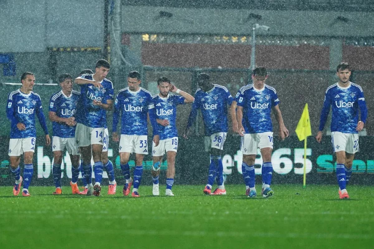 Como players walking in the rain during match Como players walking in the rain during match