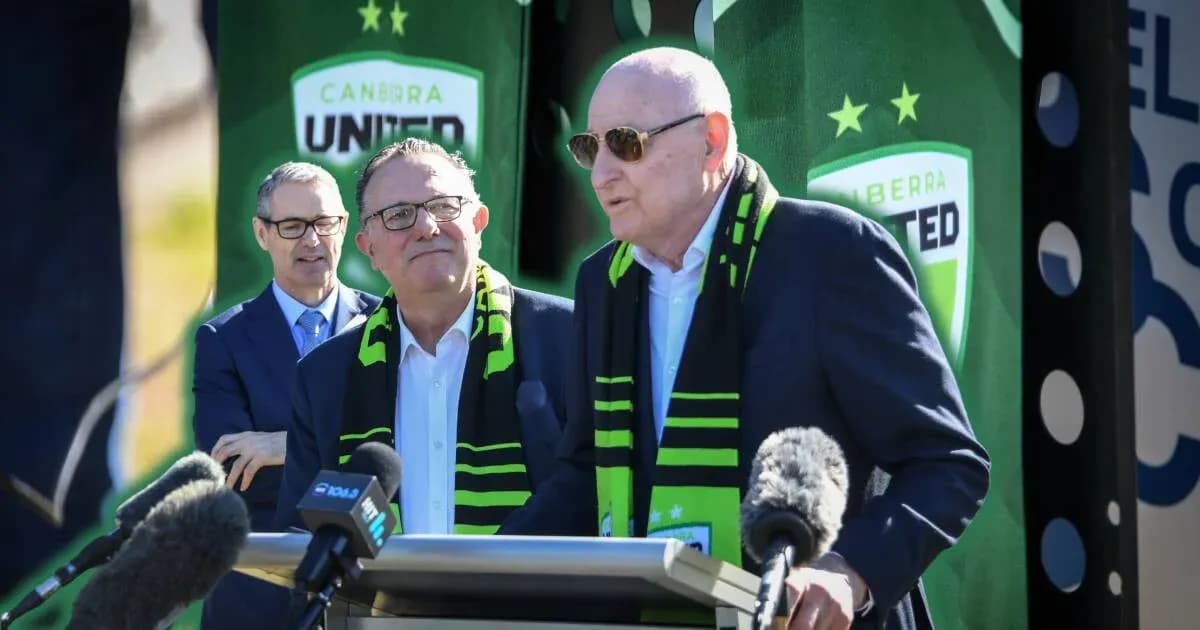 Officials at Canberra United press conference with microphones Officials at Canberra United press conference with microphones