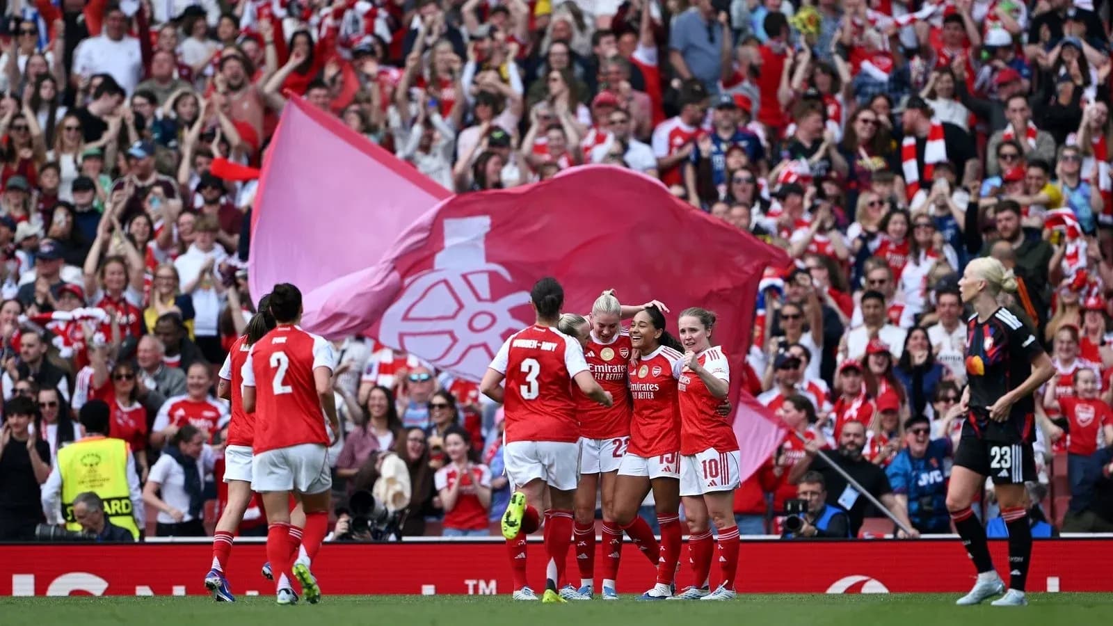 Arsenal players celebrating a goal with fans Arsenal players celebrating a goal with fans