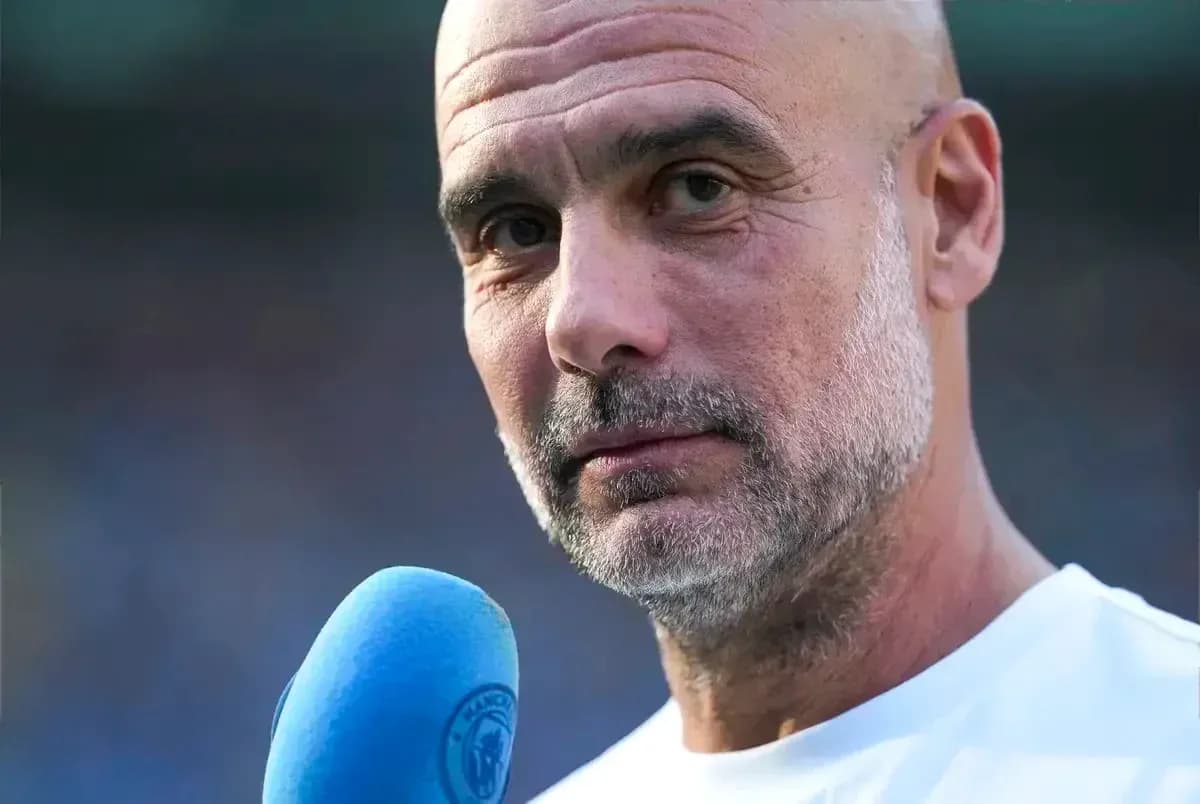 Man speaking into a microphone during interview Man speaking into a microphone during interview